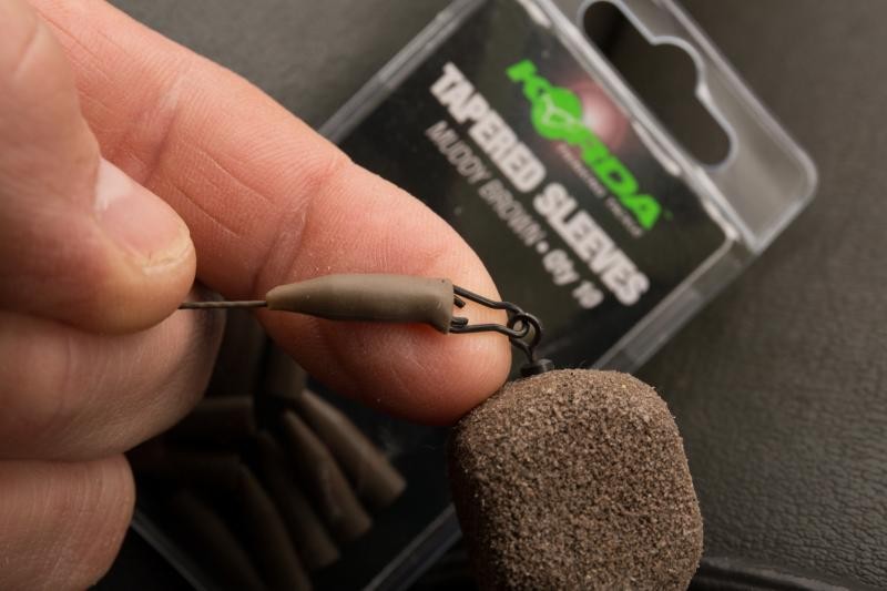Manșon protecție agrafă/vârtej Korda Tapered Silicon Sleeves, Muddy Brown, 10buc/plic